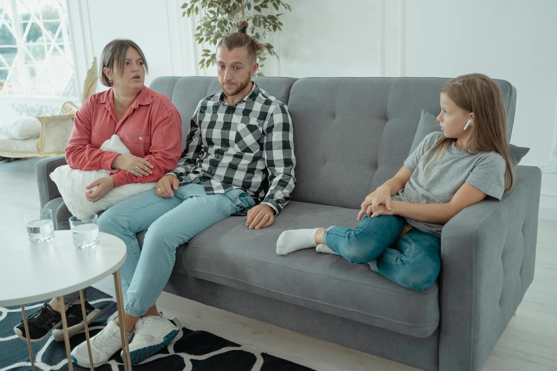 a family sitting on a couch Addiction and family relationships. addiction and family relationships