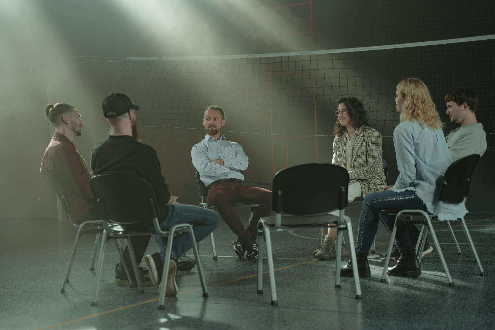 Xylazine addiction detox rehab. Group of men sitting in a circle therapy session