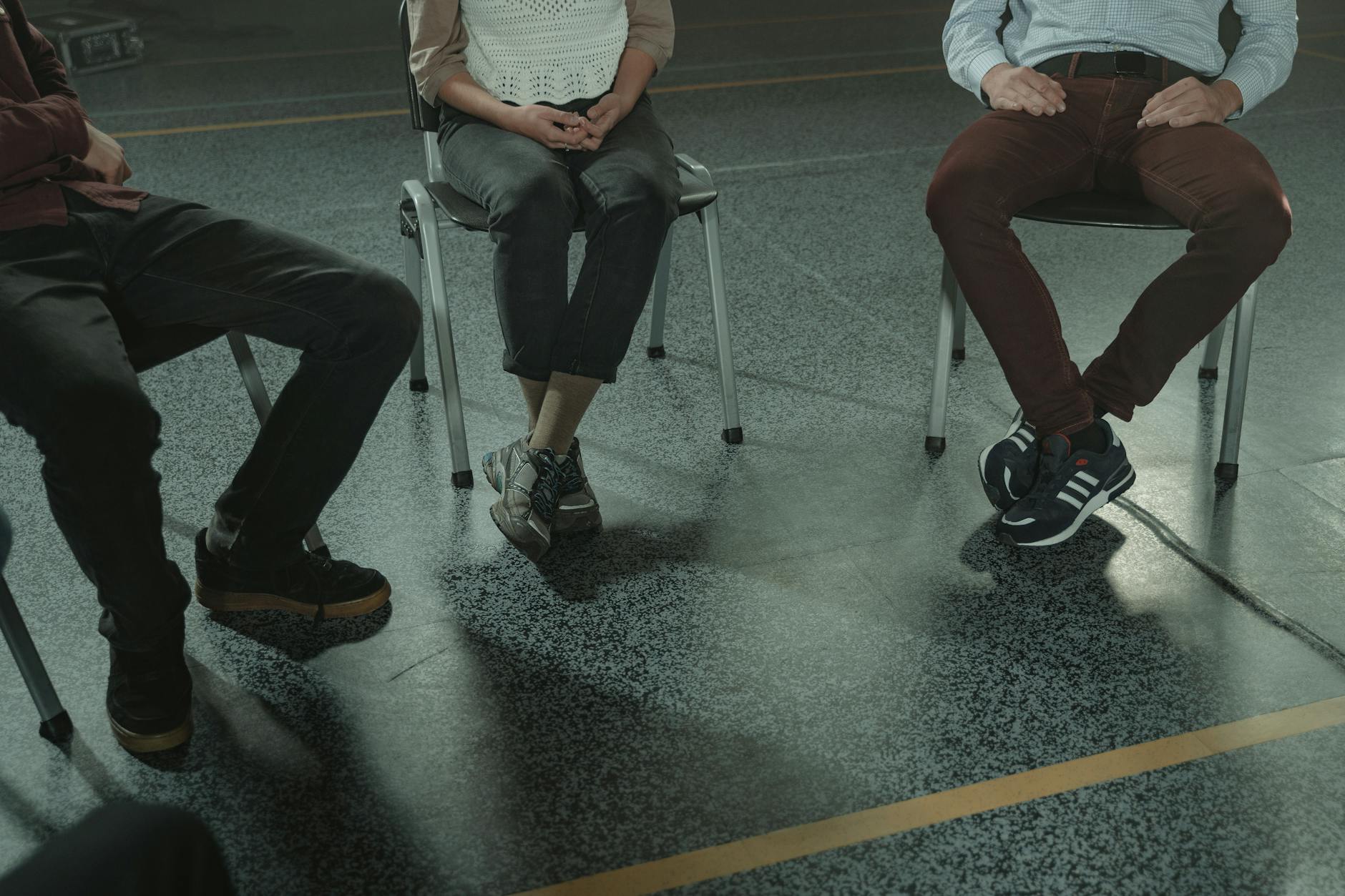 people sitting on chairs in close up photography Support for long term recovery
