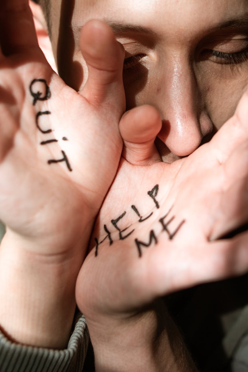  Getting help for addiction Pair of hands with the word quit written on one and help me on the other