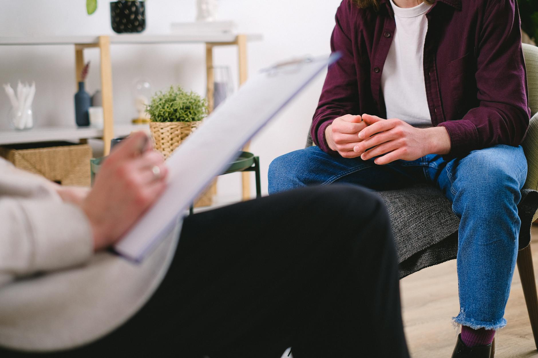 man sitting in chair at psychotherapy session