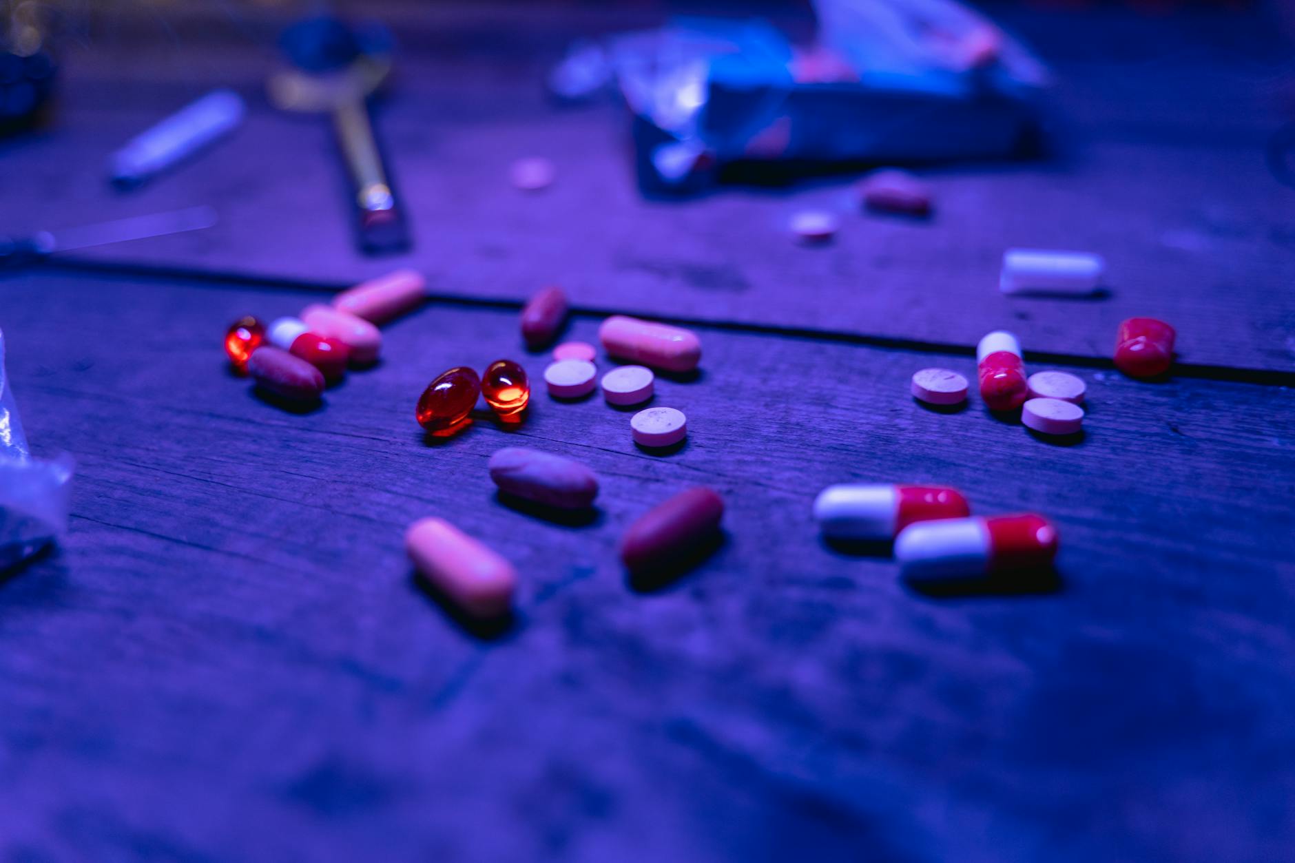 close up shot of medicines on wooden surface