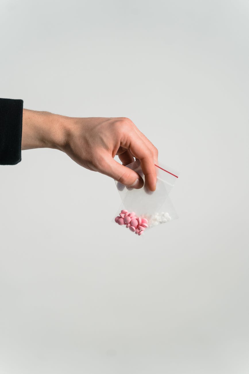 person holding sachets of drugs Pregabalin Addiction