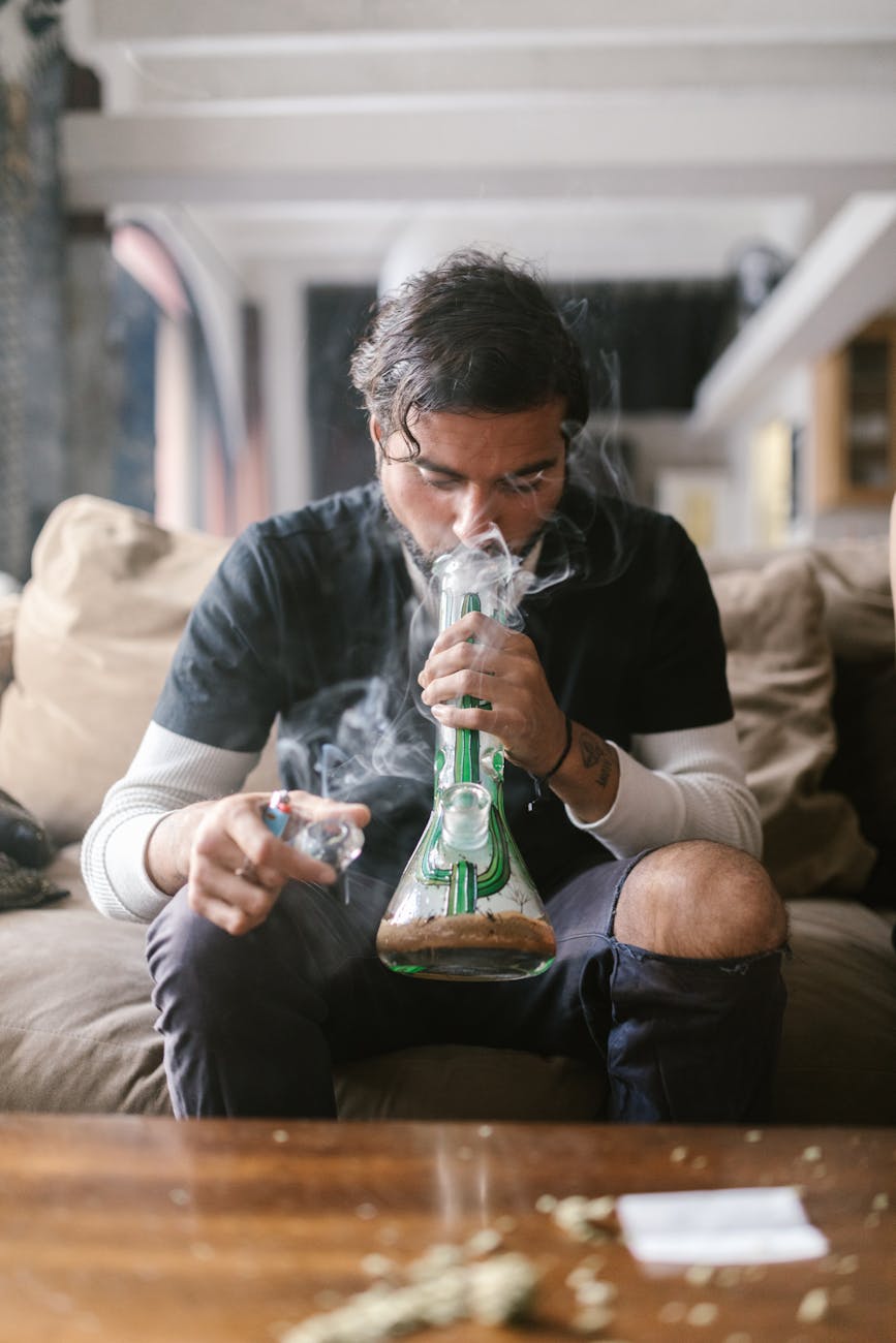 a man smoking bong Weed addiction advice