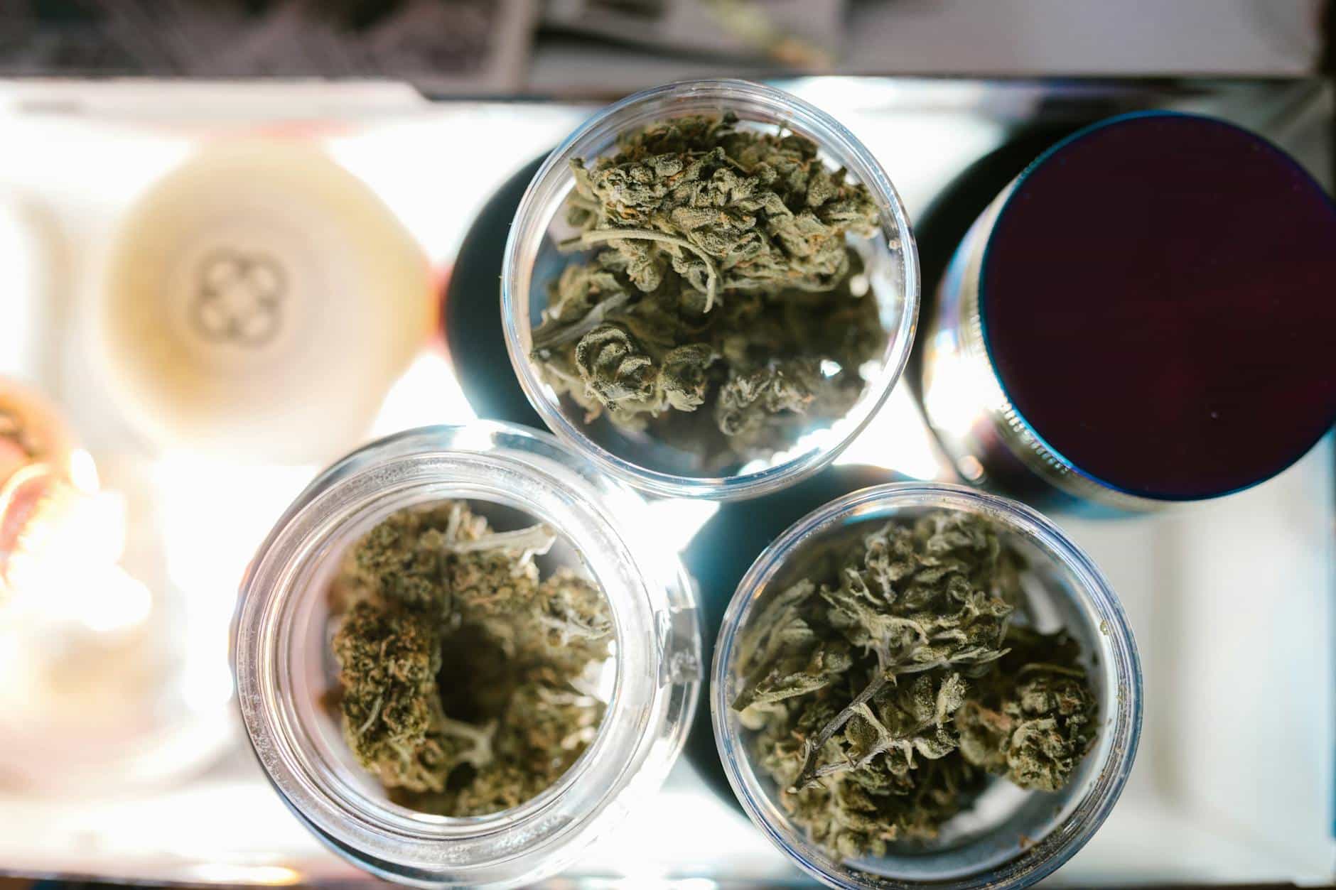 green kush in clear glass container