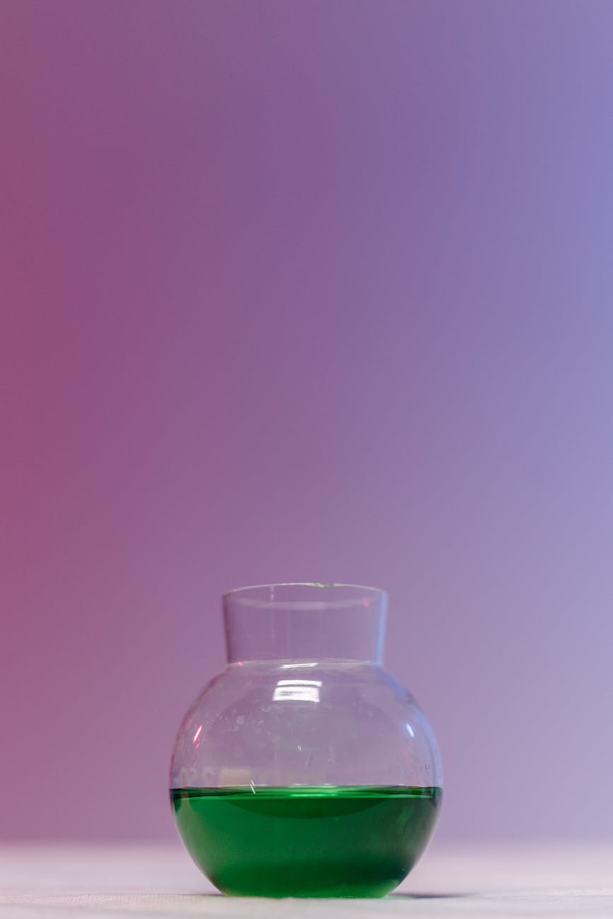 clear glass bottle with green liquid Methadone rots teeth and bones