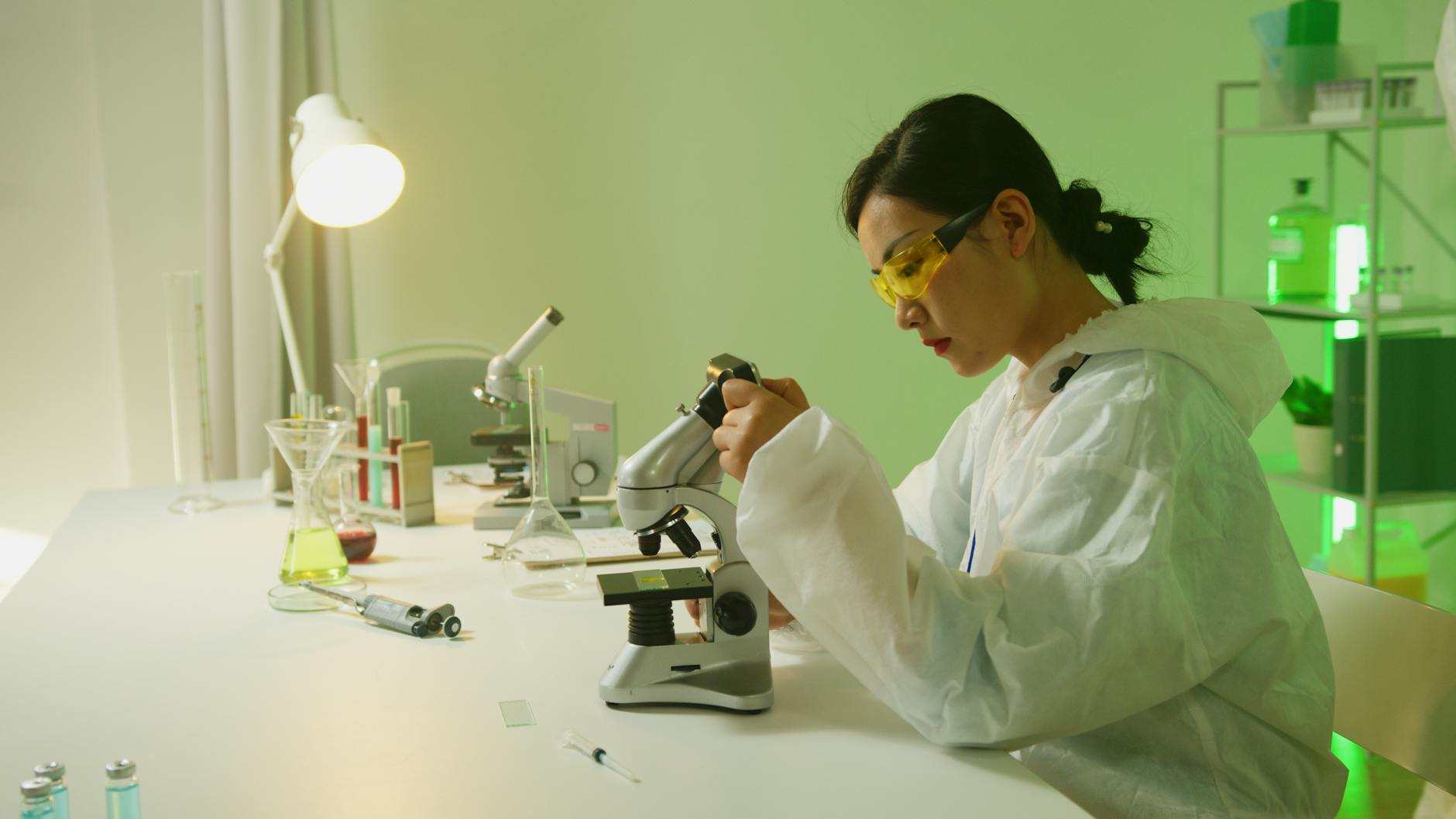 a woman sitting at the table Addiction: Genetic and environmental influences
