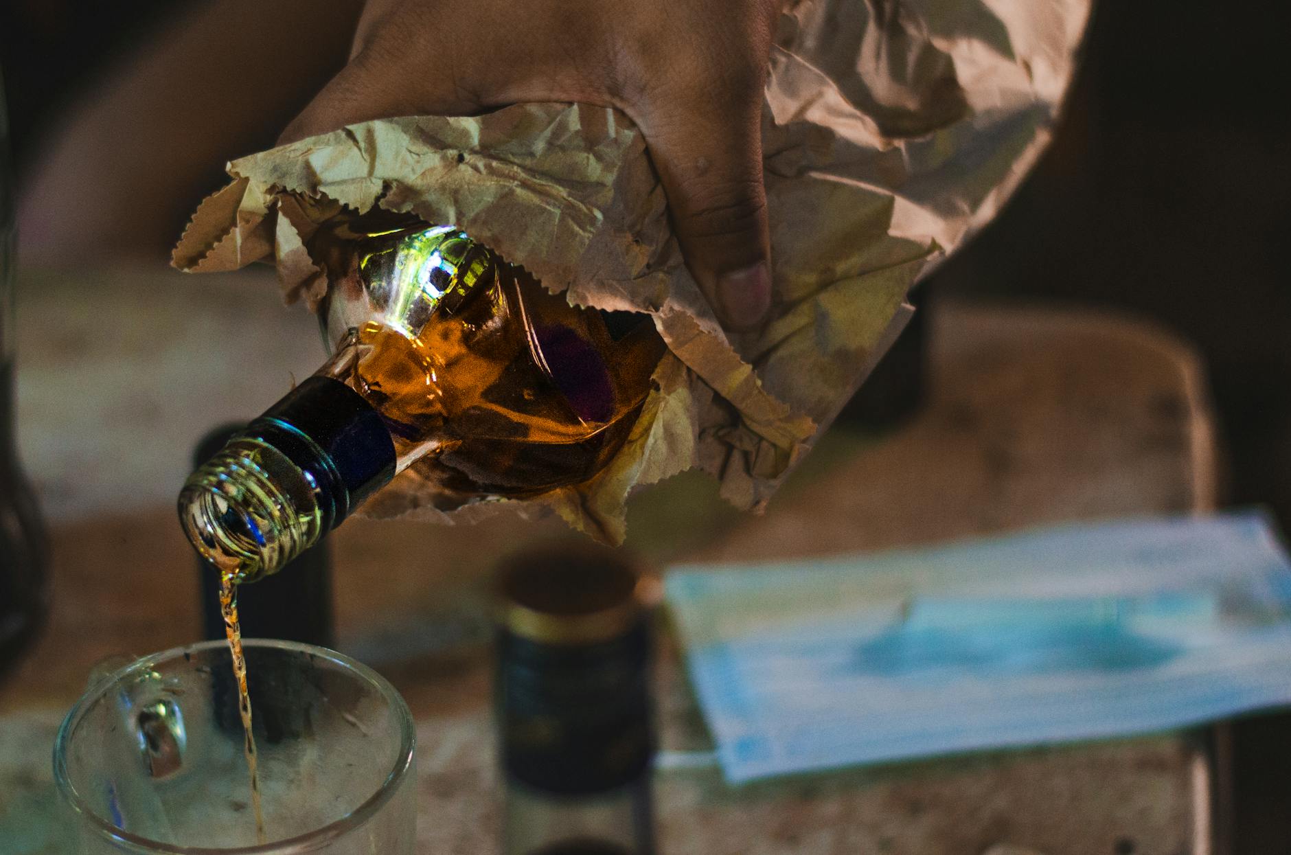 close up shot of a person pouring a liquor on a glass Is Home Alcohol Detox Safe?